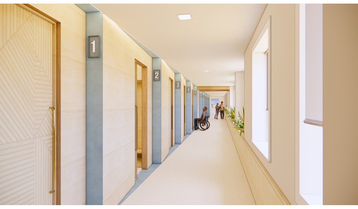 A modern hallway features numbered doors, with a person in a wheelchair and another standing nearby, green plants lining the walls.