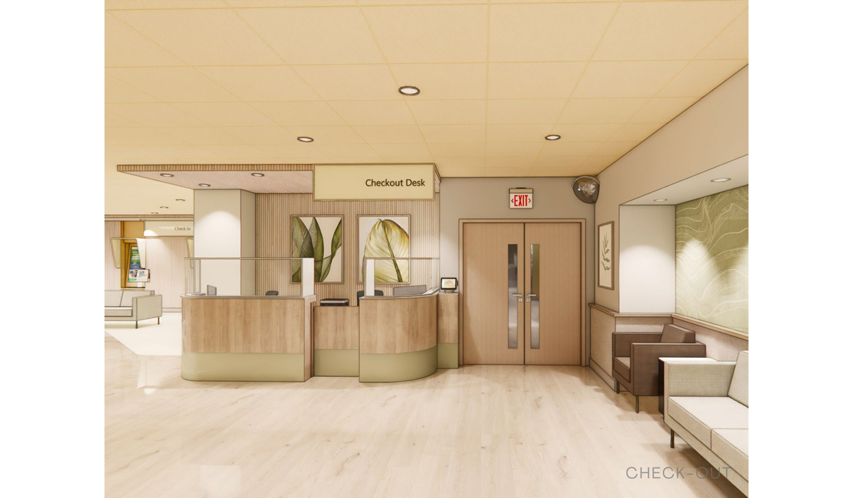 A modern healthcare facility reception area featuring a checkout desk, exit signs, and soft seating, with light wood finishes and greenery.