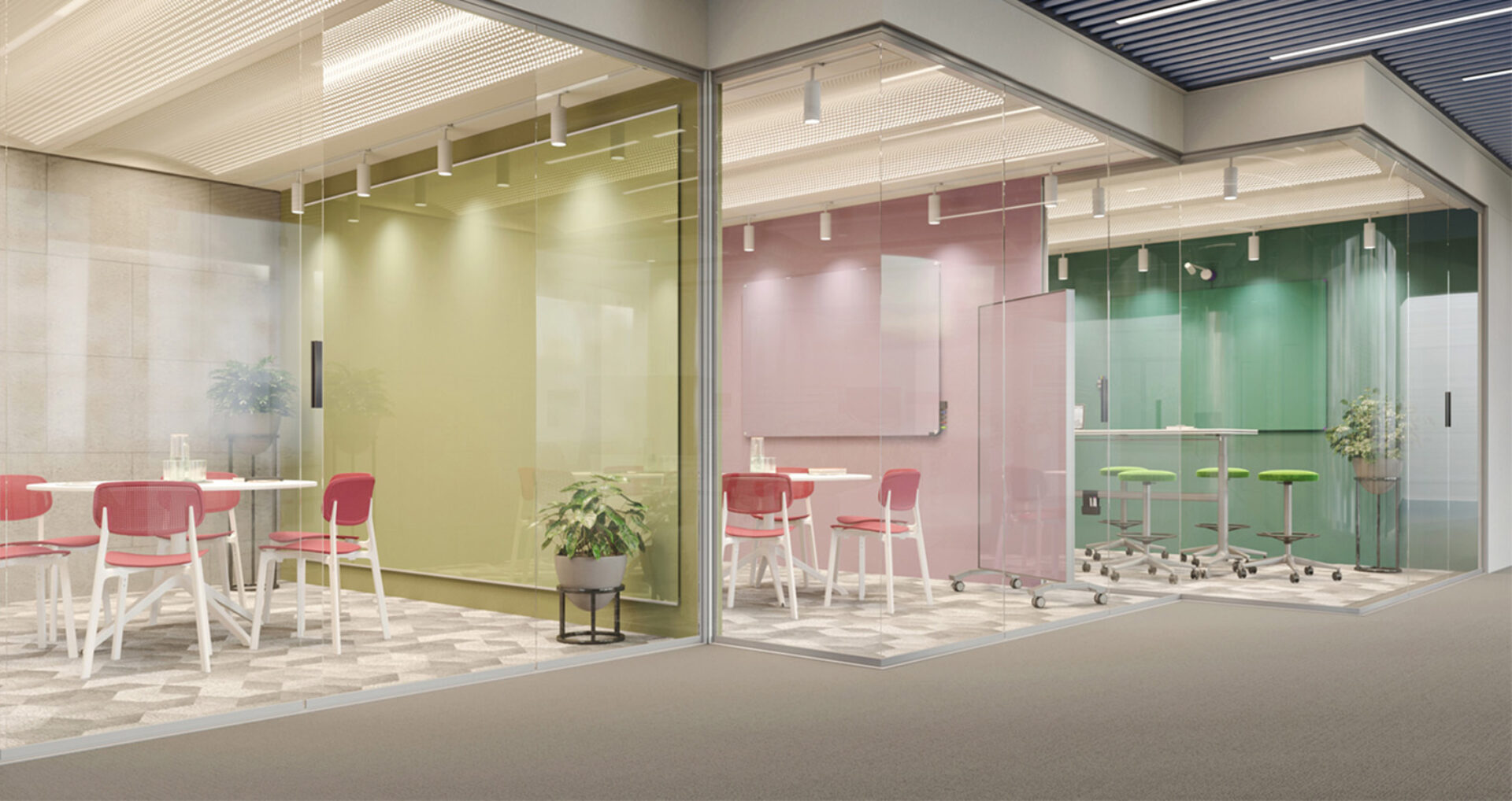 Three glass-walled meeting rooms with pastel green and pink walls, red chairs at white tables, green bar stools, potted plants, whiteboard.