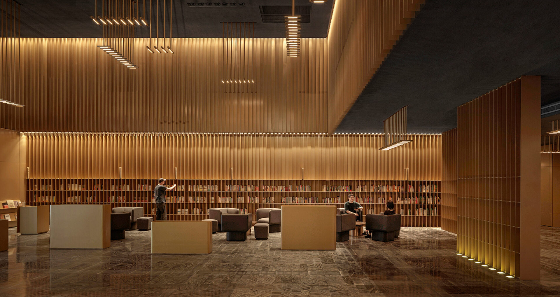 A modern library interior features warm wooden accents, cozy seating areas, and shelves filled with books, inviting quiet reading.