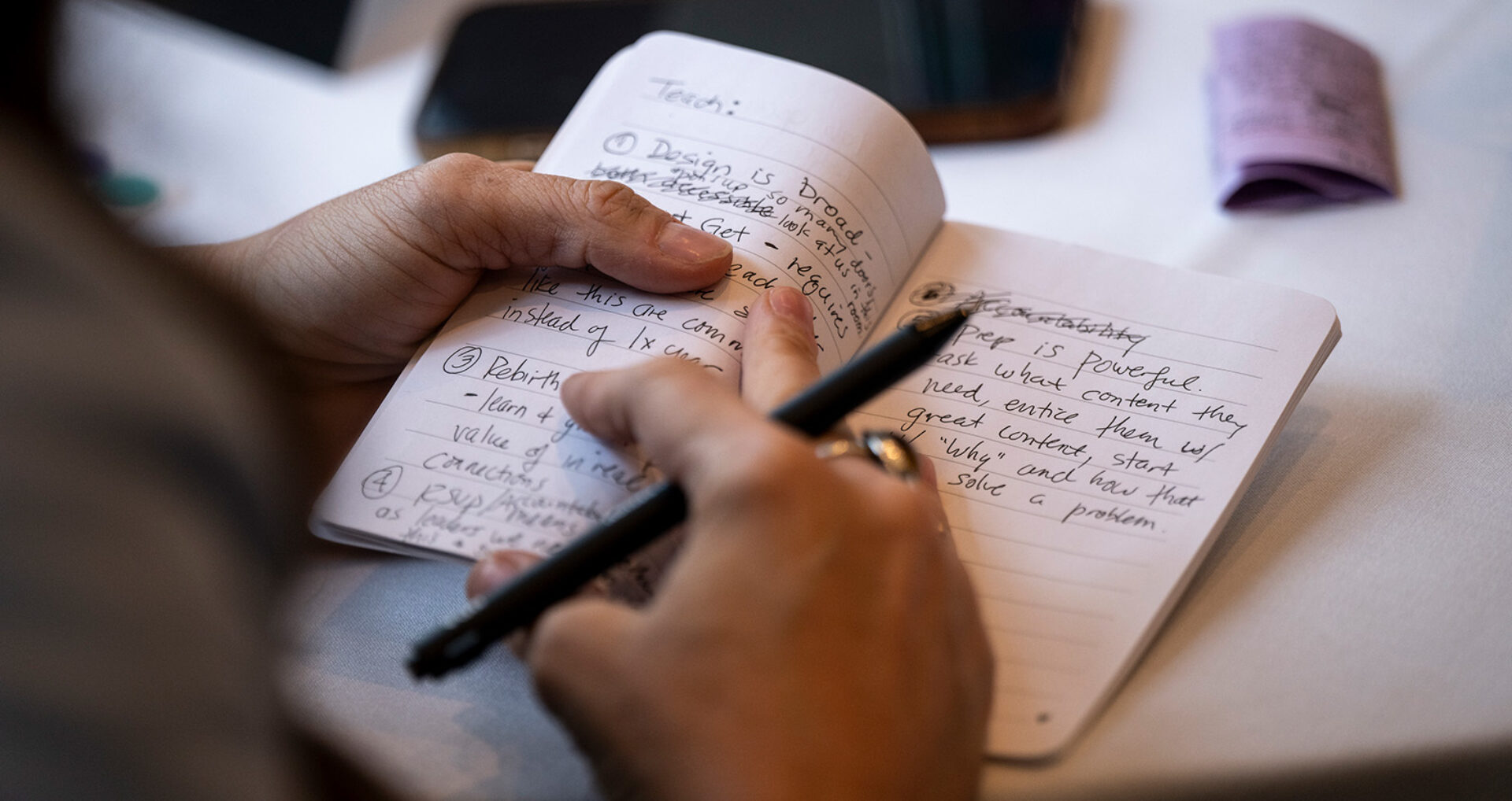 Hand and notebook Cindy officeinsight hero