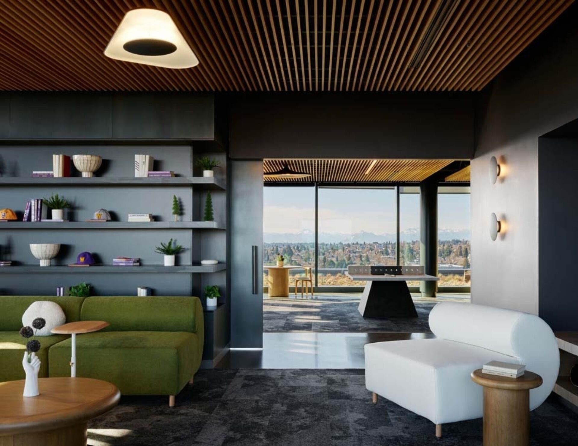 A modern interior features green and white sofas, stylish shelves with plants, and large windows showcasing a scenic view outside.