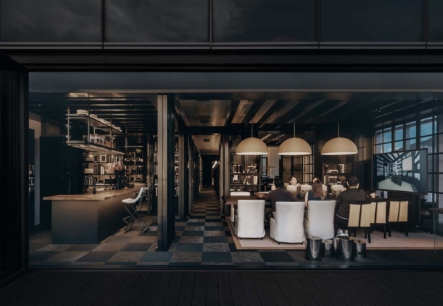 Modern dining room and kitchen blend indoor luxury with social gathering, featuring large pendants, sleek furniture, and a cozy ambiance.