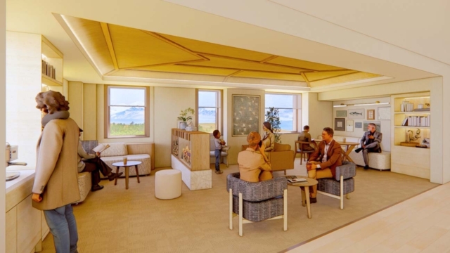 A bright, spacious lounge features several people seated, engaging in conversation, with large windows showcasing a mountain view.