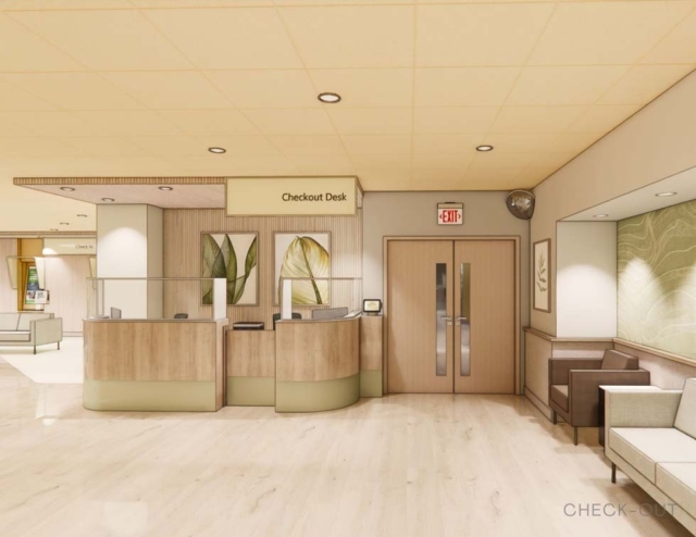 A modern reception area with a wooden checkout desk, sitting areas, and framed plant artwork on the walls, illuminated by soft lighting.