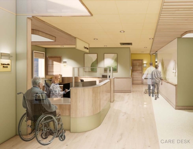 A modern healthcare reception area featuring a care desk, a patient in a wheelchair, and staff interacting with visitors.