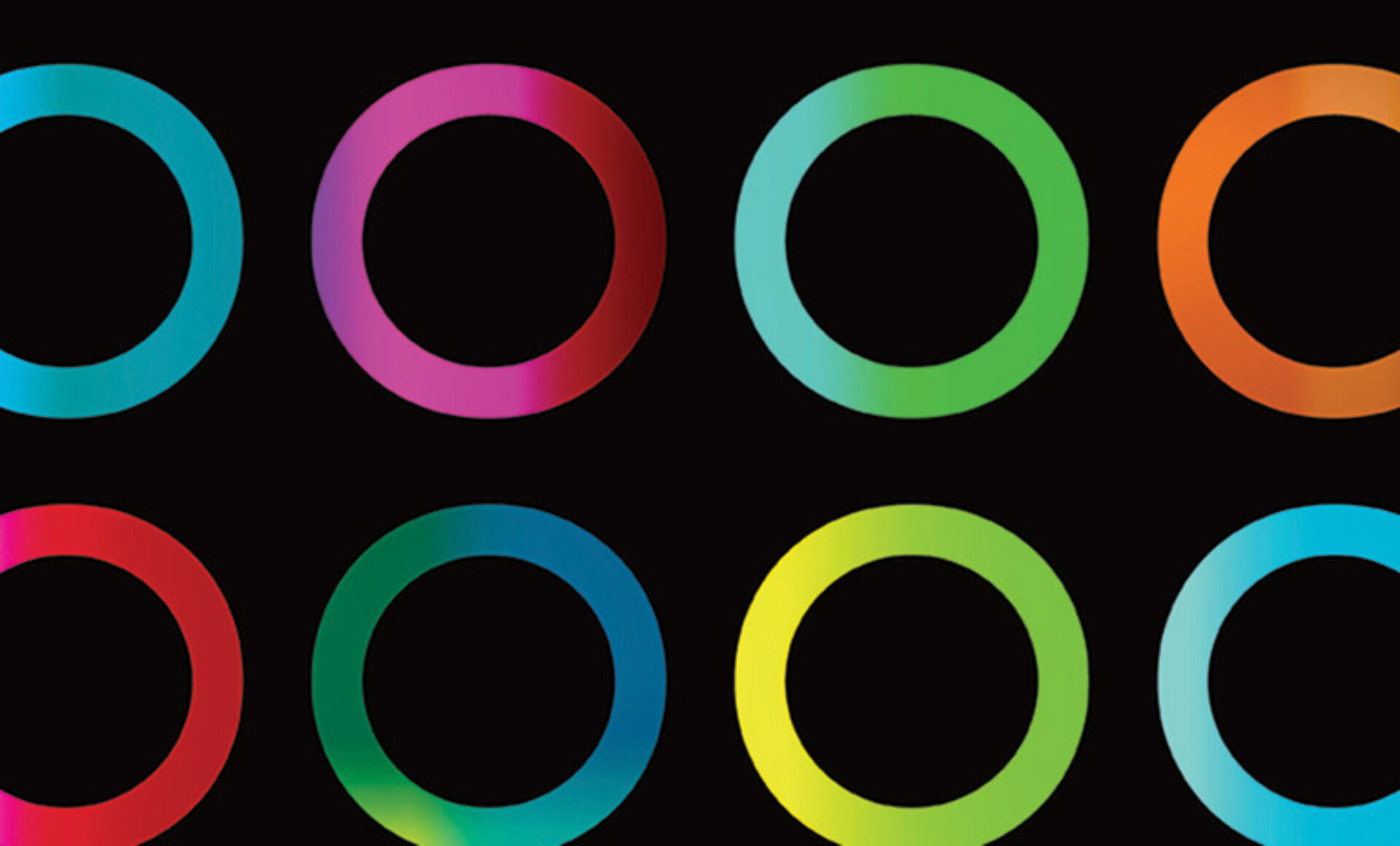 Nine evenly spaced rings with colorful gradient strokes—teal, magenta, green, orange and yellow—set against a solid black background.