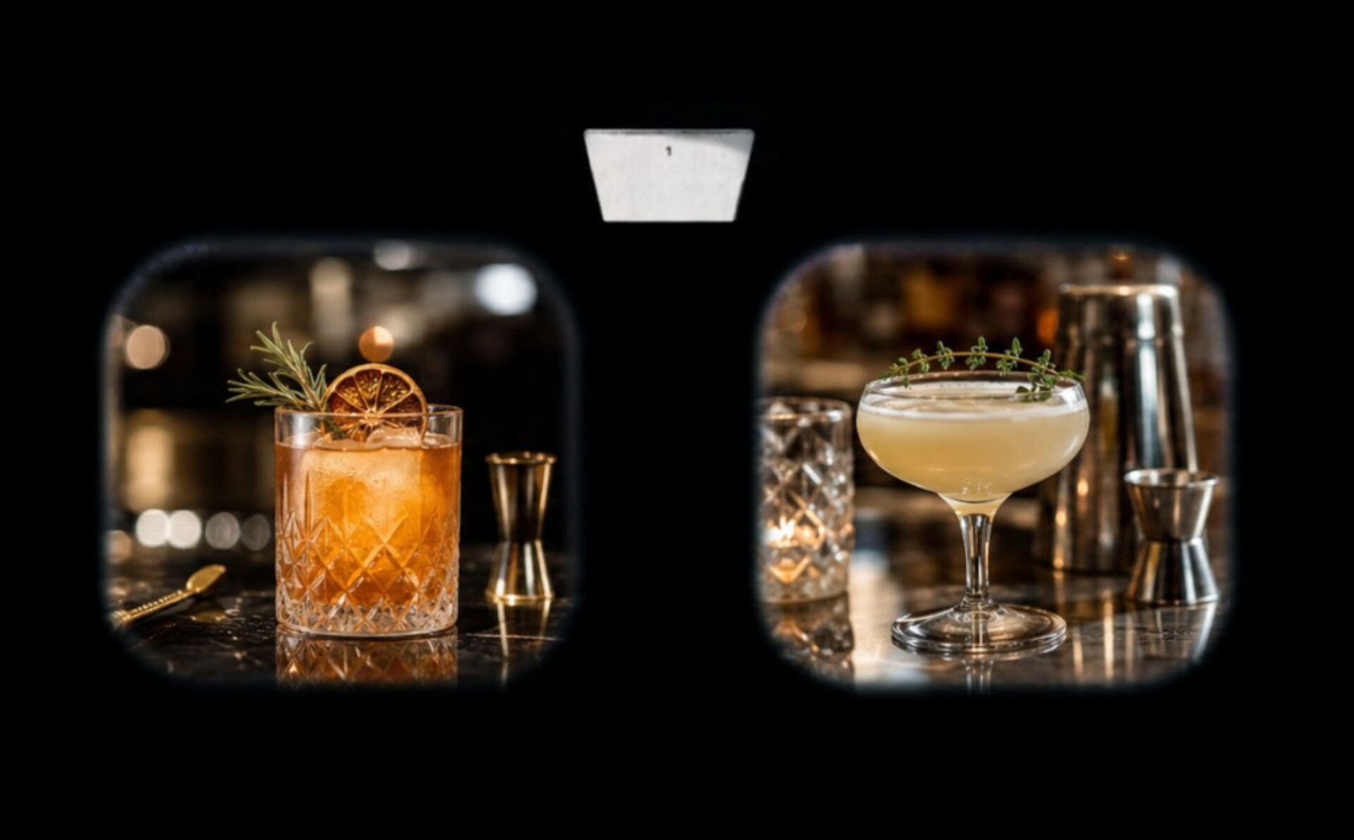Two cocktails on a marble bar: left an amber Old Fashioned in cut glass with dried orange and rosemary; right pale coupe topped with thyme.